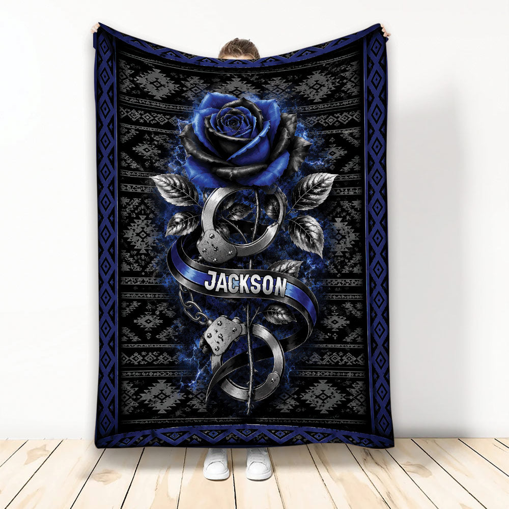 Police throw blanket featuring a blue rose, silver handcuffs, and black and blue geometric artwork