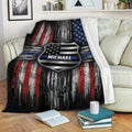 Police badge throw blanket displayed on a sofa with distressed red, white, blue, and black artwork