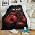 Boxing throw blanket draped over a sofa with bold red boxing glove artwork