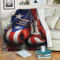 Boxing blanket draped over a couch, showcasing red and blue gloves with distressed patriotic artwork
