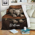 Elephant throw blanket displayed on a sofa with realistic wildlife artwork and rich brown tones