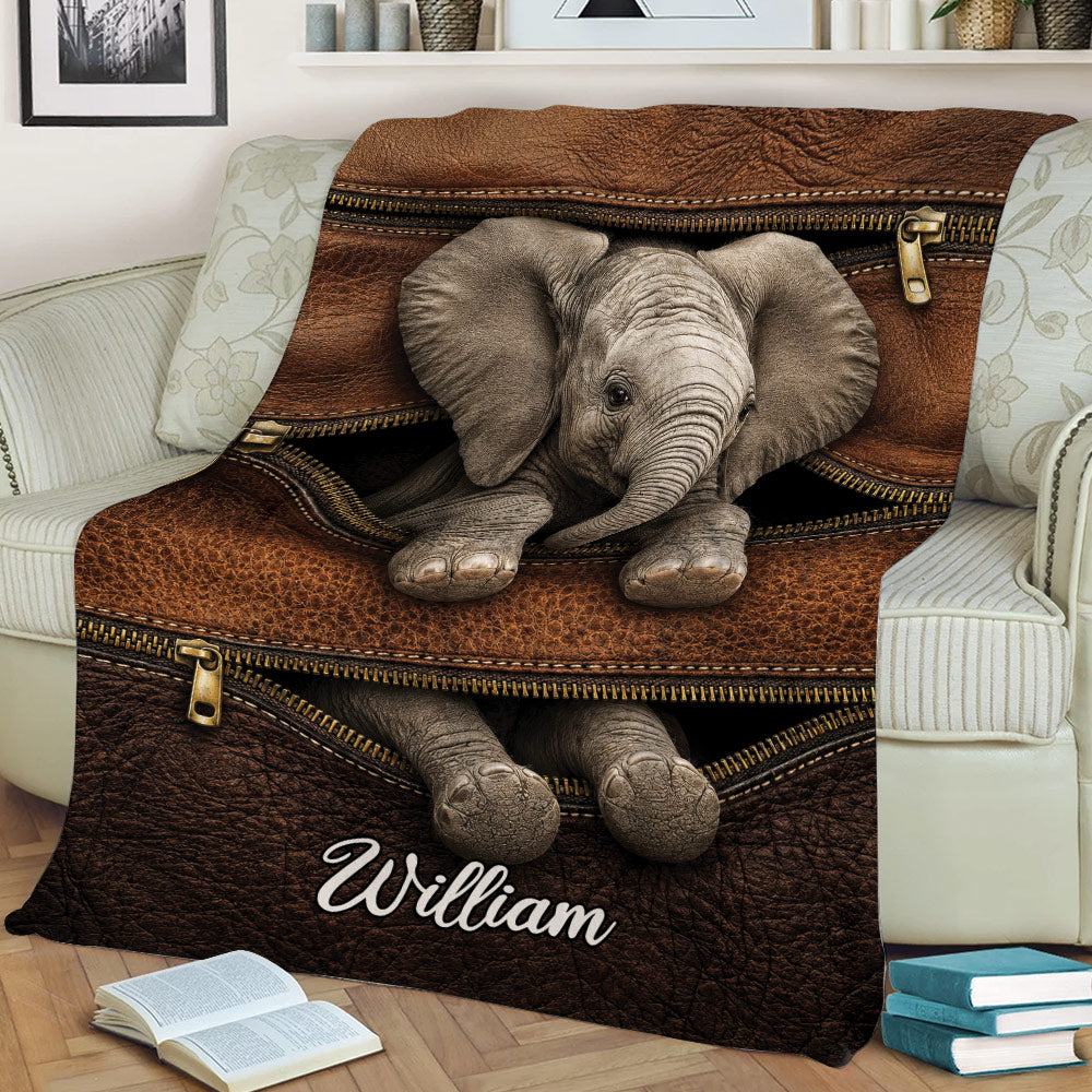 Custom elephant blanket draped over a couch, showcasing a lifelike elephant and zipper-inspired artwork