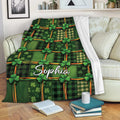 Irish shamrock tartan blanket draped over a sofa for cozy living room decor