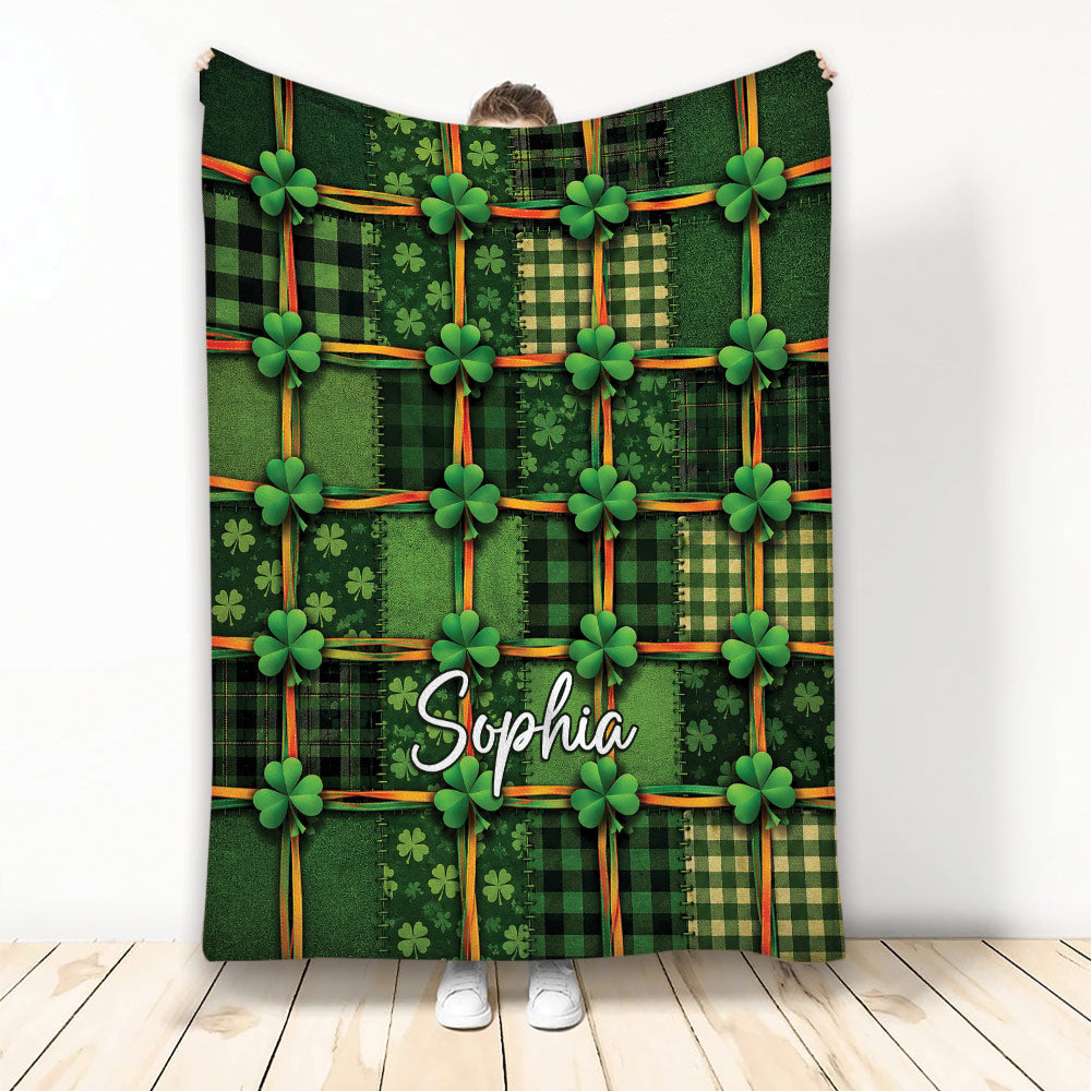 Irish throw blanket with green tartan patchwork, shamrocks, and colorful ribbon accents