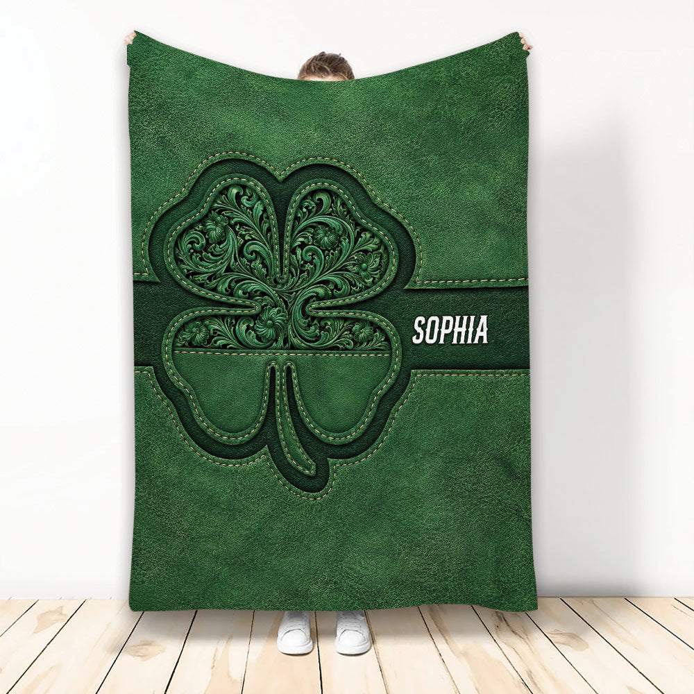 Green Irish shamrock throw blanket with ornate Celtic-inspired artwork displayed as a cozy wrap