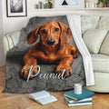 Dachshund throw blanket draped across a sofa with a realistic brown dog design