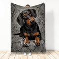 Black and tan Dachshund blanket displayed against a textured gray background