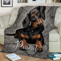 Dachshund throw blanket draped over a chair with detailed black and tan dog artwork