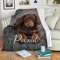Brown dachshund throw blanket draped over a sofa with cozy living room decor