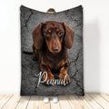 Brown dachshund blanket displayed upright with cracked stone artwork in a lifestyle setting