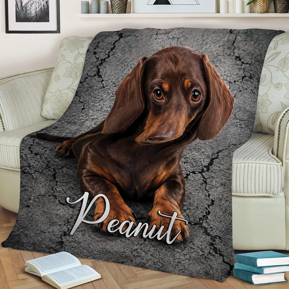 Brown dachshund blanket styled across a chair with cracked stone background artwork