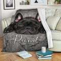 French Bulldog blanket draped over a sofa with a playful black Frenchie design