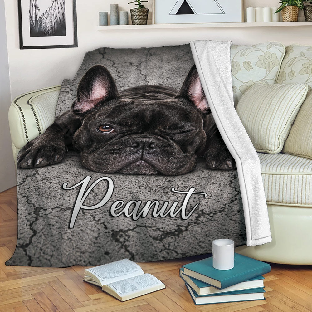 French Bulldog blanket draped over a sofa with a playful black Frenchie design