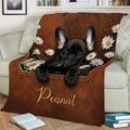 Close view of a black French Bulldog throw blanket with daisies and brown leather-inspired styling