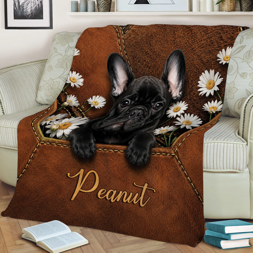 Close view of a black French Bulldog throw blanket with daisies and brown leather-inspired styling
