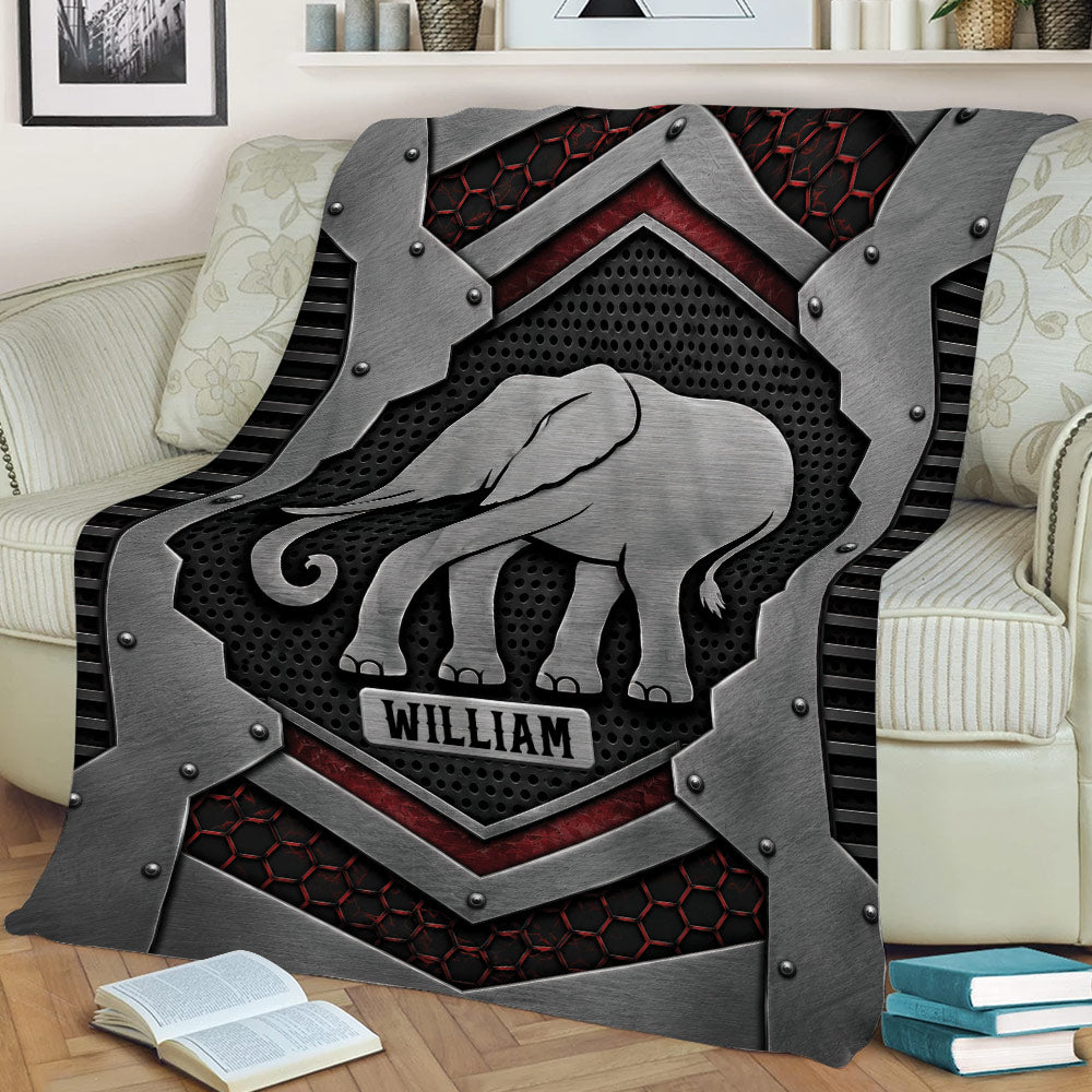 Metallic elephant throw blanket styled across a sofa in a modern living room