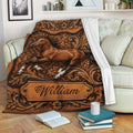Rustic horse throw blanket displayed on a sofa with ornate floral scrollwork and warm brown tones