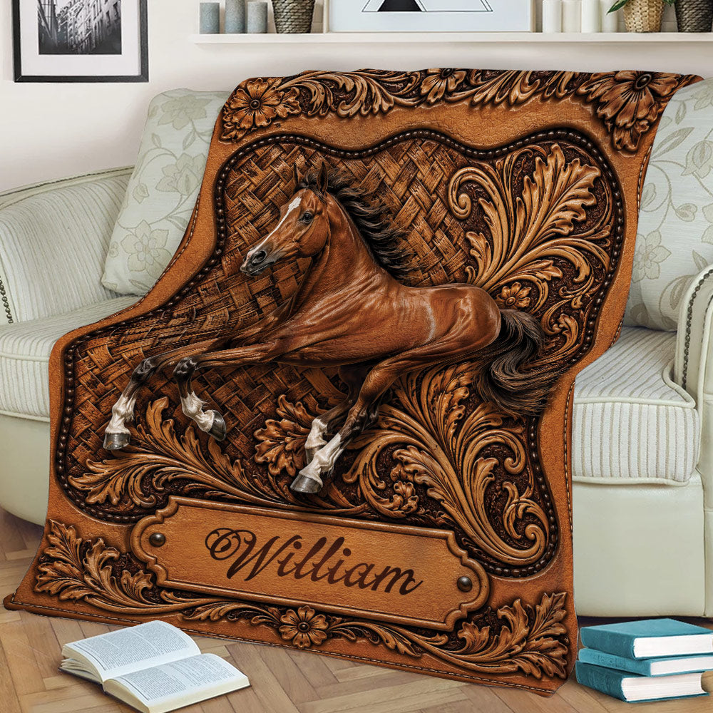 Close view of an ornate horse blanket draped over a sofa with detailed equestrian artwork