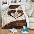 Rustic horse throw blanket draped over a sofa with heart-shaped horse artwork
