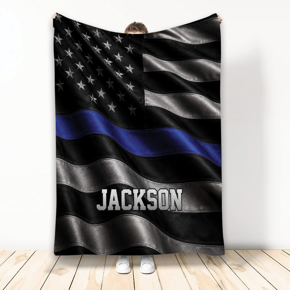 Police throw blanket with black and silver flag design, blue line detail, and star pattern