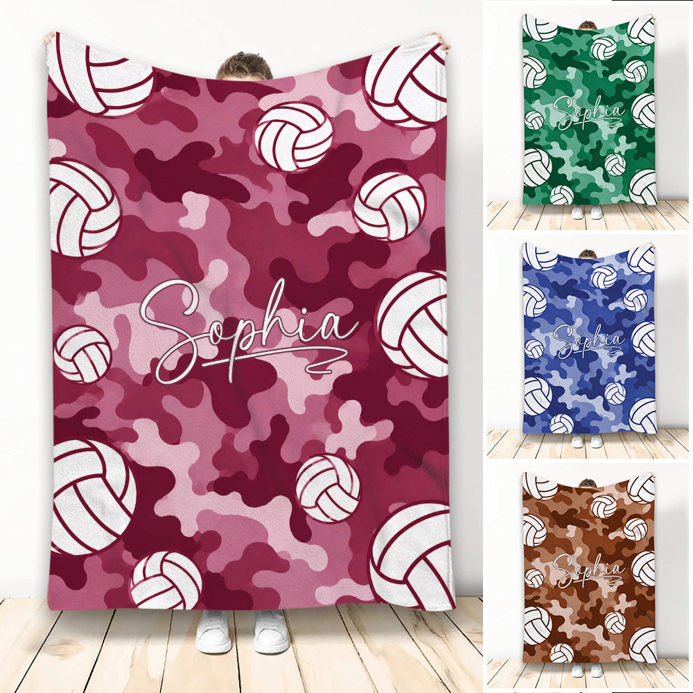 Pink camouflage volleyball throw blanket with repeating volleyball artwork and a central script design