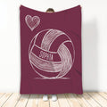 Maroon volleyball blanket featuring a large sketch-style volleyball and heart accent