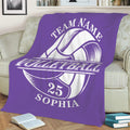 Purple volleyball throw blanket spread across a sofa with oversized ball graphic