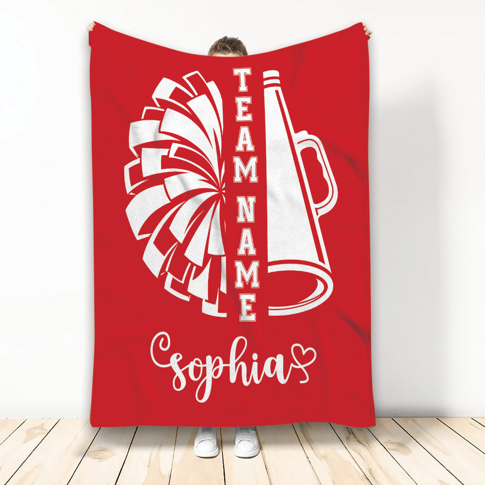 Red cheerleading throw blanket featuring white pom-poms and megaphone artwork