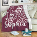 Maroon cheerleading throw blanket displayed on a sofa with megaphone and pom-pom artwork