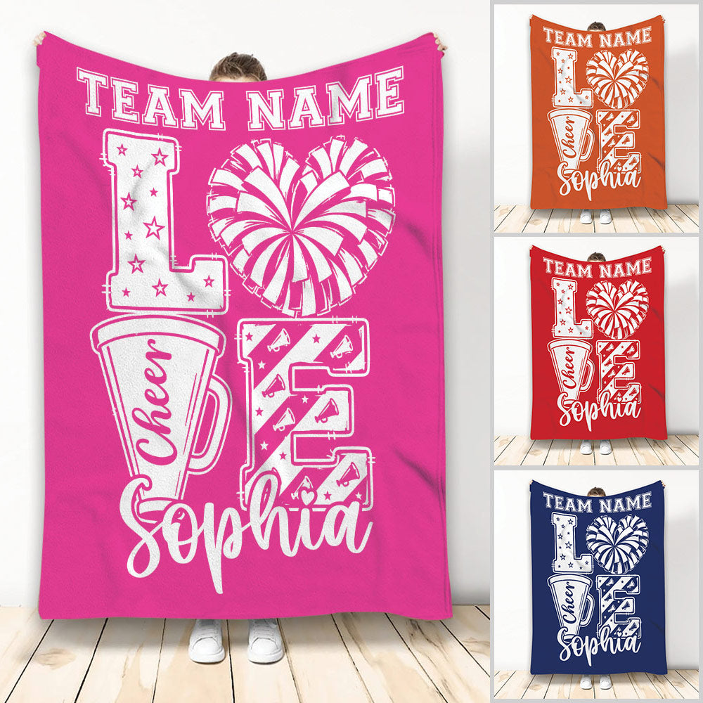 Pink cheerleading throw blanket with pom-pom, megaphone, star, and cheer squad artwork