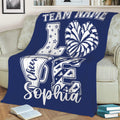 Navy blue cheerleading throw blanket draped over a sofa with energetic cheer artwork