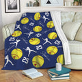 Navy softball throw blanket draped over a sofa with yellow softball and player artwork