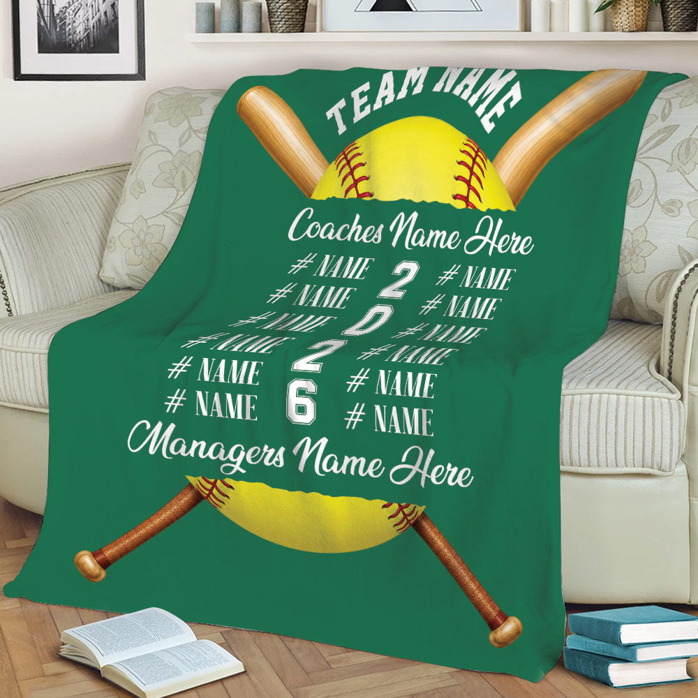 Green softball throw blanket displayed on a sofa with crossed bats and bold team sports artwork