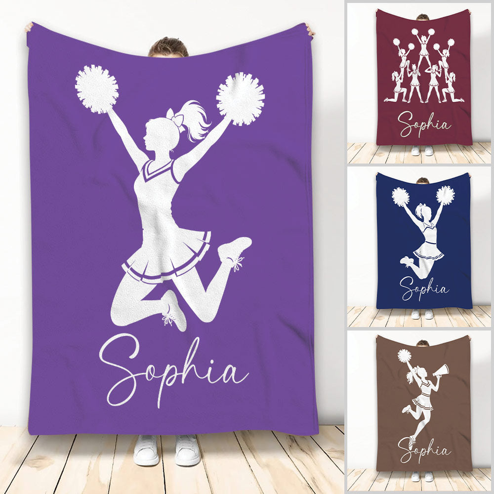 Purple cheerleading blanket with a jumping cheerleader silhouette holding pom-poms