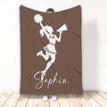 Brown cheerleading blanket featuring a cheerleader silhouette with pom-pom and megaphone
