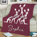 Maroon cheerleading throw blanket with a group of cheerleaders performing together