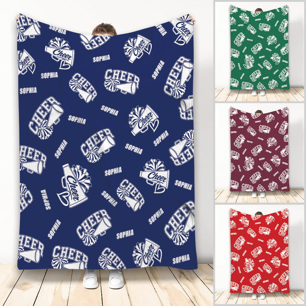 Cheerleading throw blanket with repeating megaphone and pom-pom artwork in navy blue
