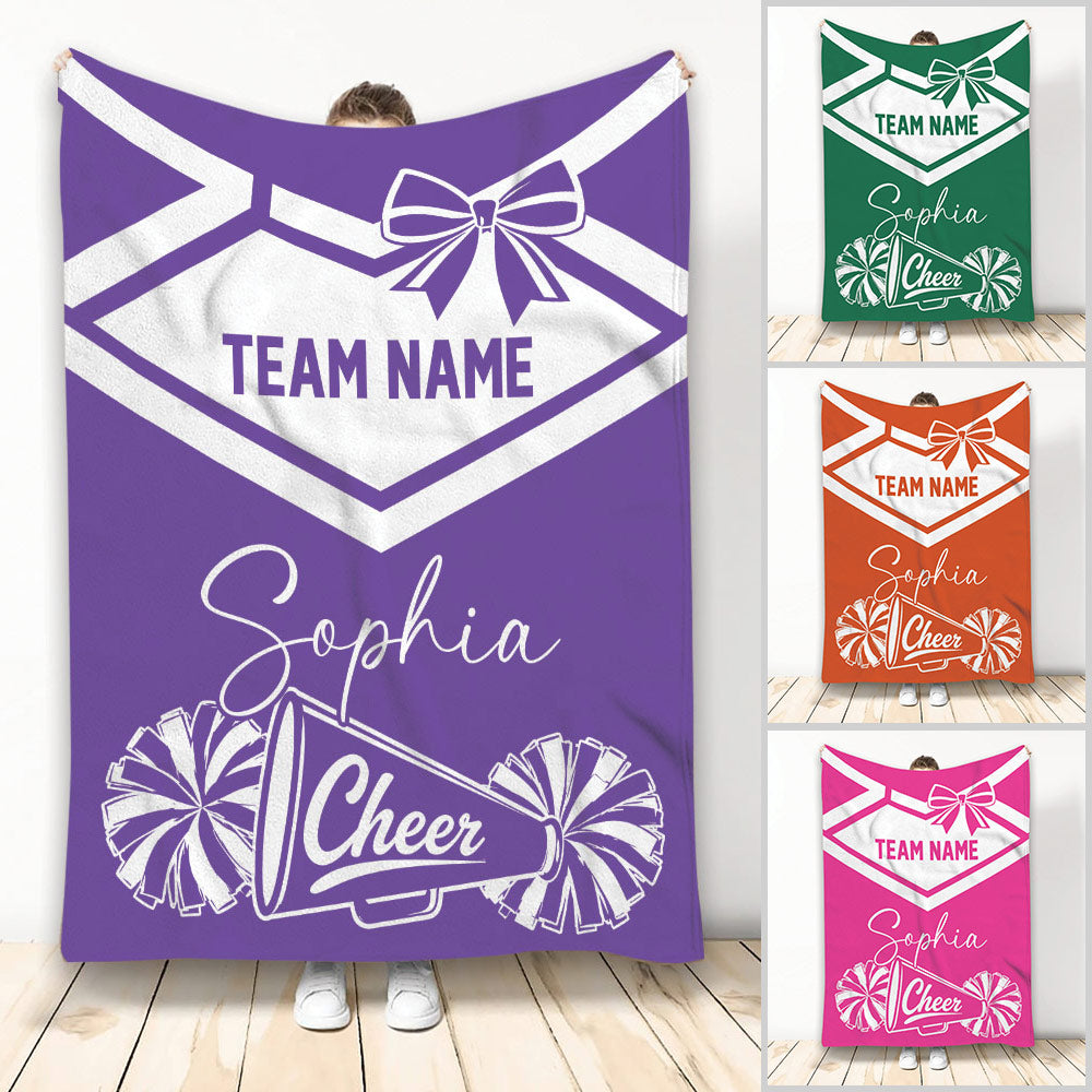 Purple cheerleading throw blanket with bow, pom-poms, megaphone, and team spirit artwork
