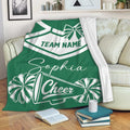 Green cheerleading blanket draped over a sofa with pom-poms and megaphone artwork