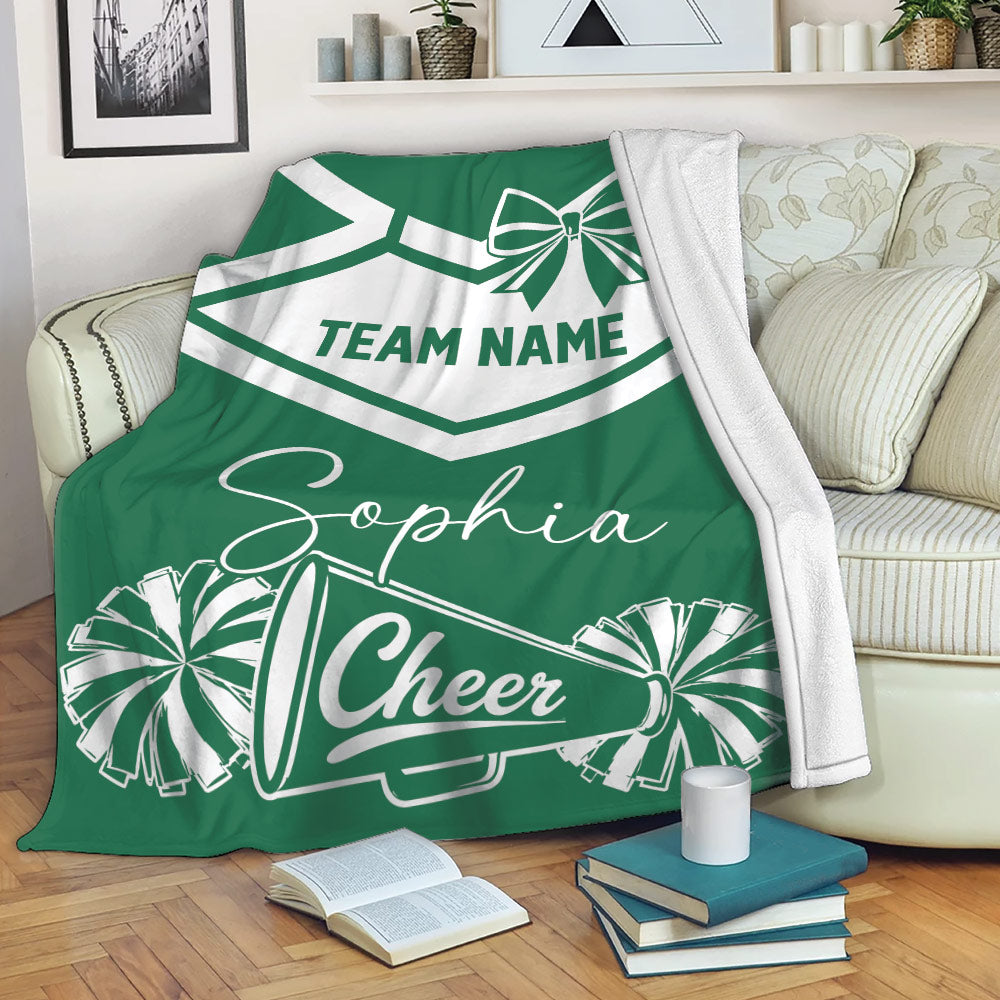 Green cheerleading blanket draped over a sofa with pom-poms and megaphone artwork