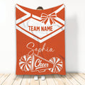 Orange cheerleading throw blanket featuring a bow, pom-poms, and cheer megaphone design