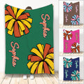 Cheerleading throw blanket with colorful pom-pom artwork in green, orange, and yellow