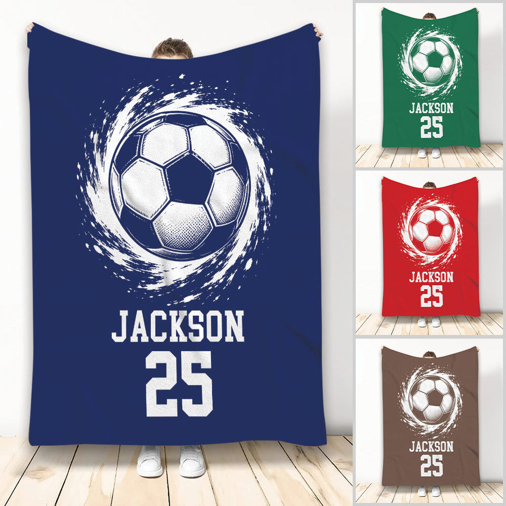 Soccer throw blanket with dynamic soccer ball artwork and bold sports design in multiple colors