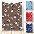 Custom soccer blanket featuring soccer balls, player silhouettes, bold numbers, and a repeating sports design