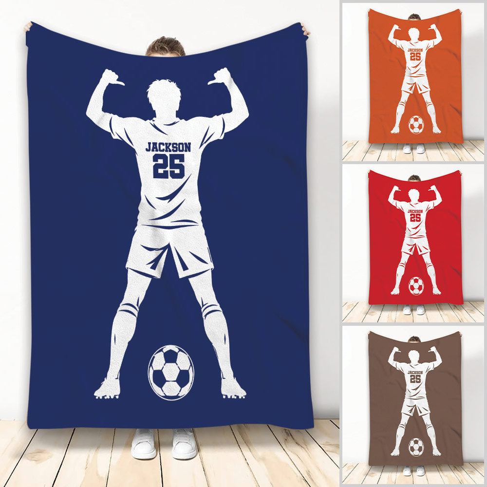 Soccer throw blanket featuring a flexing player silhouette, soccer ball, and multiple color design options