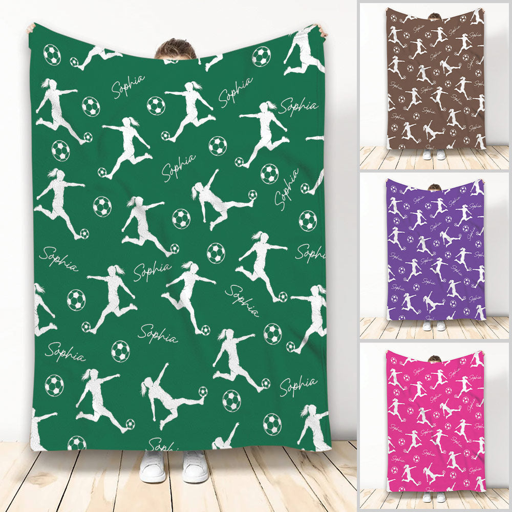 Green soccer throw blanket featuring repeating female player silhouettes, soccer balls, and decorative script