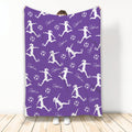 Purple soccer throw blanket displaying repeating soccer player silhouettes and soccer ball artwork