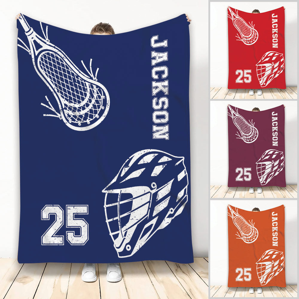 Lacrosse throw blanket with helmet and stick artwork in multiple color options