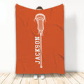 Orange lacrosse blanket displayed vertically with a centered white lacrosse stick design