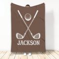 Brown golf blanket with crossed club artwork and a golf ball in a bold white design